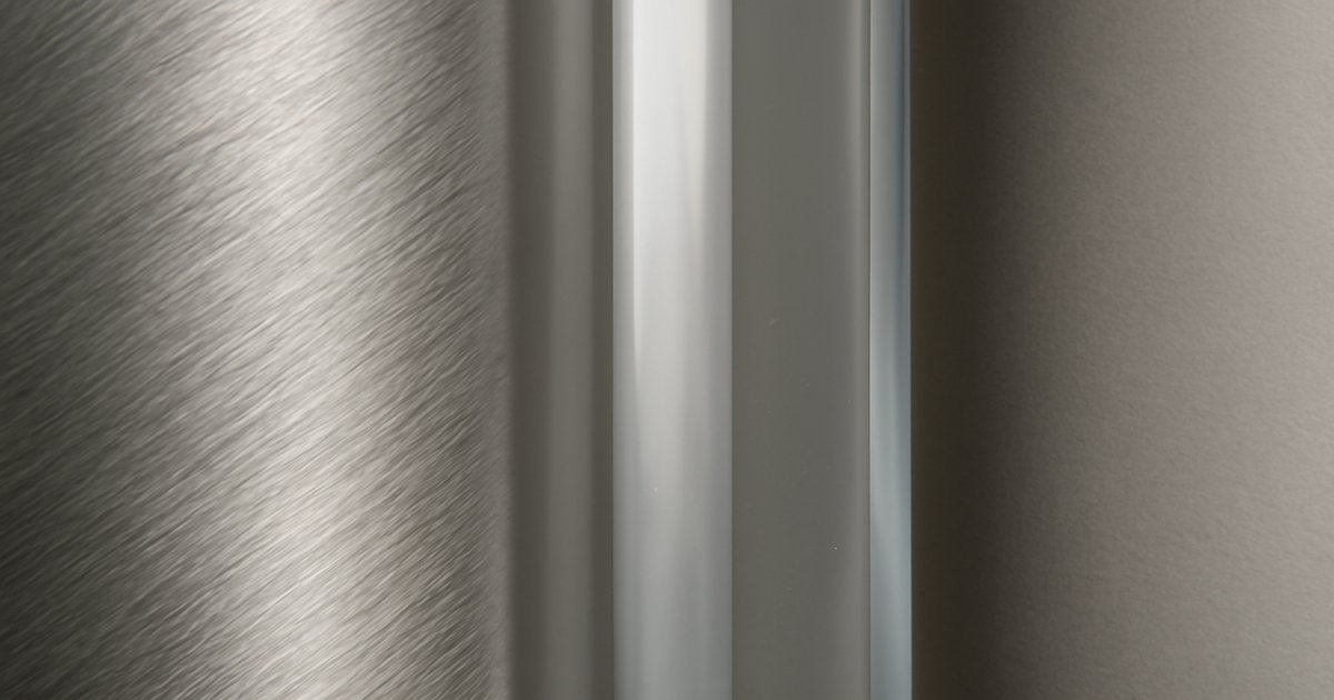 Three tumblers made from glass, stainless steel, and ceramic
