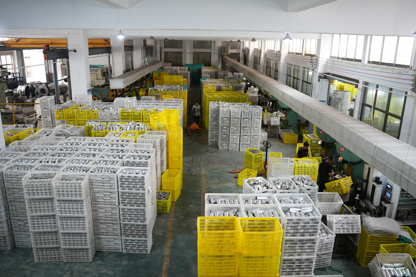 Overhead view of warehouse floor with thousands of tumbler crates