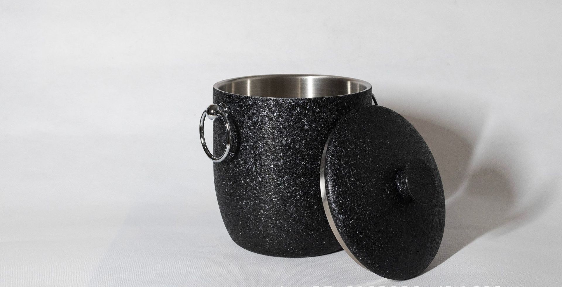 Insulated ice bucket in matte black powder coat — double-wall vacuum, keeps ice 12+ hours