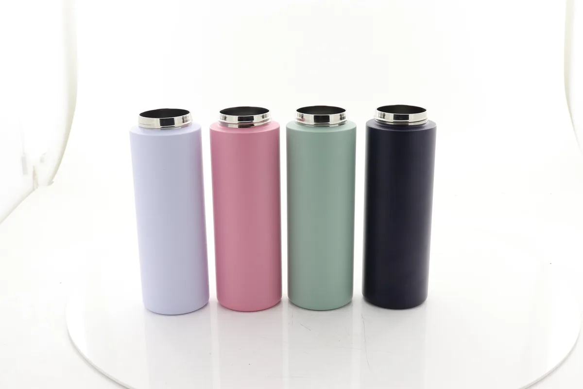 Uncoated 316 stainless steel bottle bodies before powder coating, showing the bare double-wall shells that are vacuum sealed at the base