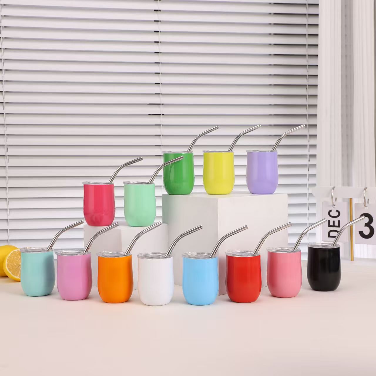 15-color insulated egg wine tumblers displayed with stainless steel straws — OEM wholesale
